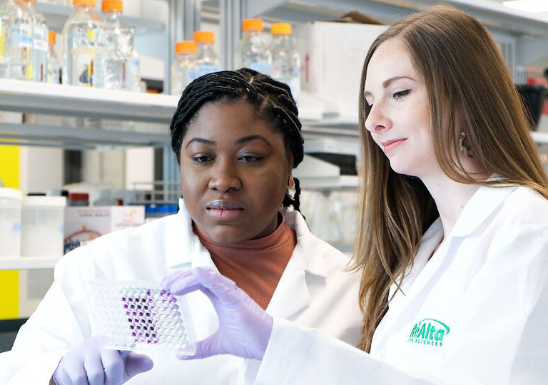 women in lab coats working